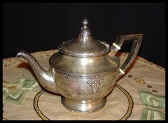 The teapot shown in the tarnished condition before we polished it.  